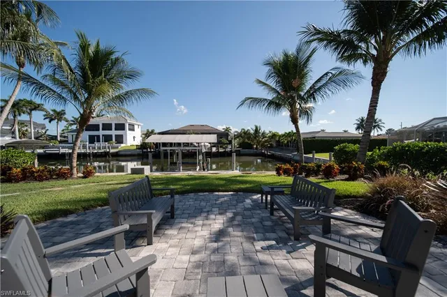 a view of a house with backyard porch and sitting area