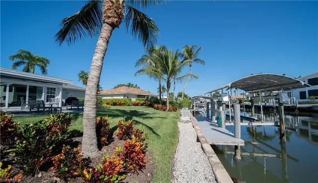 a view of a house with swimming pool and porch with furniture
