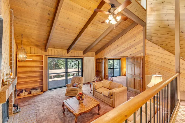 a picture of a room with furniture and a rug