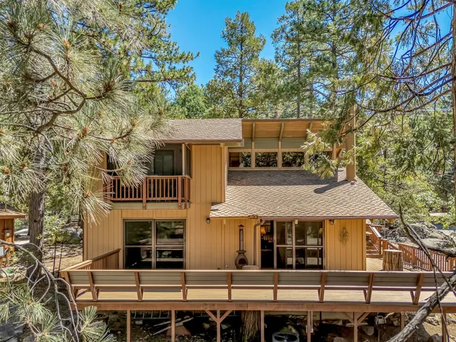 a view of a livingroom with furniture and a fireplace