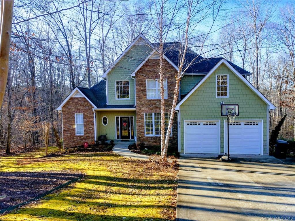 220 Beechtree Circle Rutherfordton, NC 28139 - Photo 1 of 26 a front view of a house with a yard outdoor seating and garage