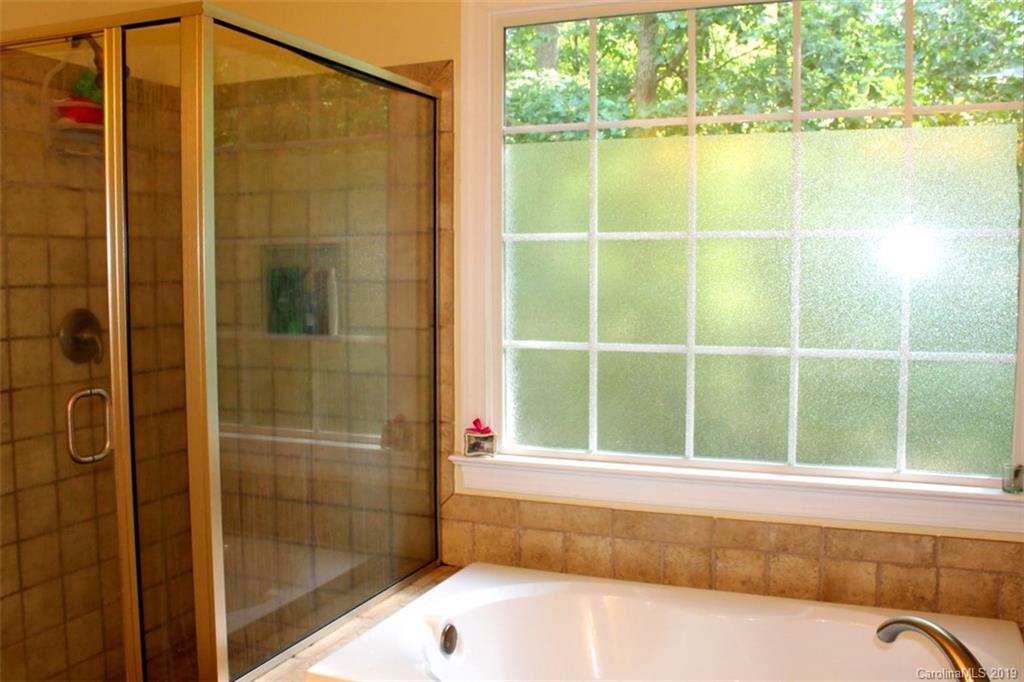 220 Beechtree Circle Rutherfordton, NC 28139 - Photo 14 of 26 a bathroom with a shower and a bath tub