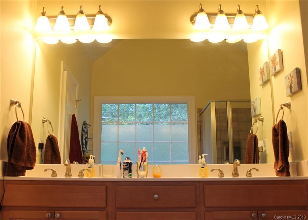 220 Beechtree Circle Rutherfordton, NC 28139 - Photo 16 of 26 a bathroom with a sink and a mirror