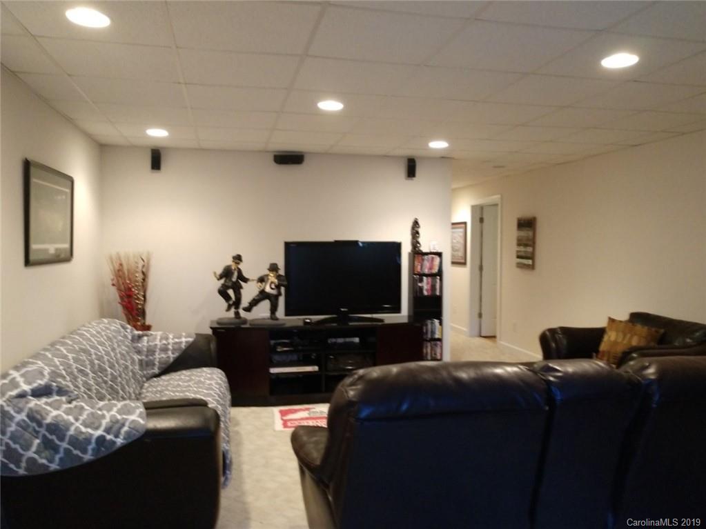 220 Beechtree Circle Rutherfordton, NC 28139 - Photo 20 of 26 a living room with furniture and a flat screen tv