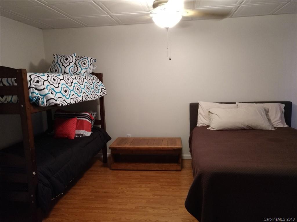 220 Beechtree Circle Rutherfordton, NC 28139 - Photo 22 of 26 a bedroom with a bed and a television