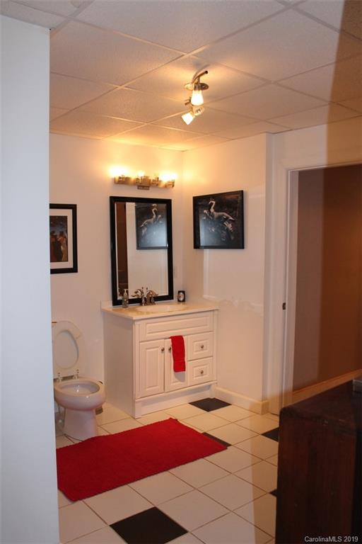 220 Beechtree Circle Rutherfordton, NC 28139 - Photo 25 of 26 a bathroom with a sink and a mirror