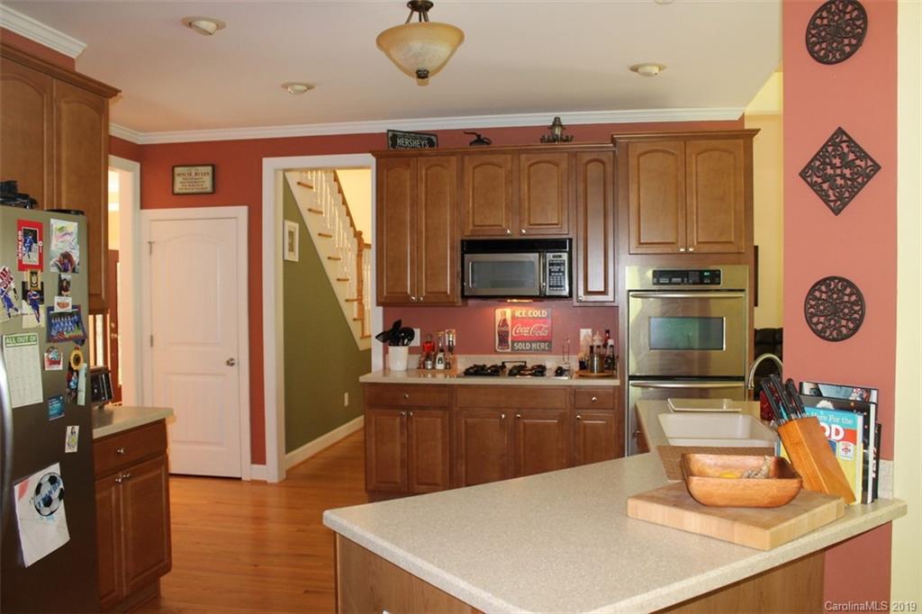 220 Beechtree Circle Rutherfordton, NC 28139 - Photo 9 of 26 a kitchen with a refrigerator a stove top oven a sink and dishwasher
