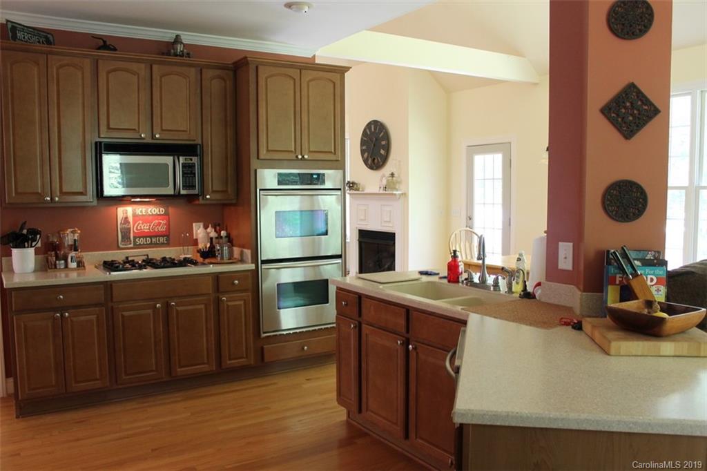 220 Beechtree Circle Rutherfordton, NC 28139 - Photo 10 of 26 a kitchen with cabinets and center island