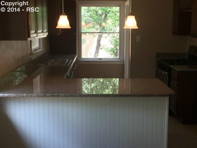 838 East Rio Grande Street Colorado Springs, CO 80903 - Photo 8 of 25 Plenty of Granite countertops, breakfast bar fits 3 adults comfortably