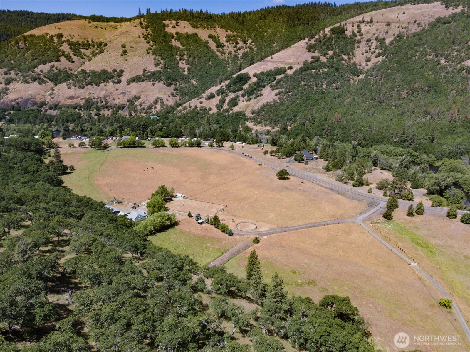 992 Highway 142 Lyle, WA 98635 - Photo 14 of 40 an aerial view of a houses with a lake view