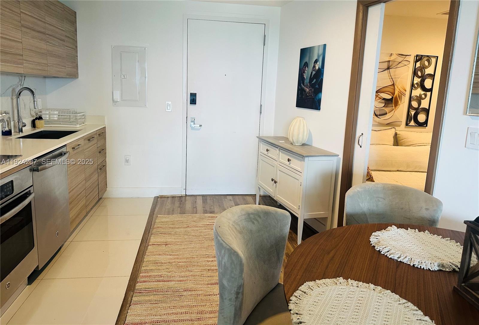 121 Northeast 34th Street, Unit 3014 Miami, FL 33137 - Photo 19 of 54 a bathroom with a sink toilet and mirror