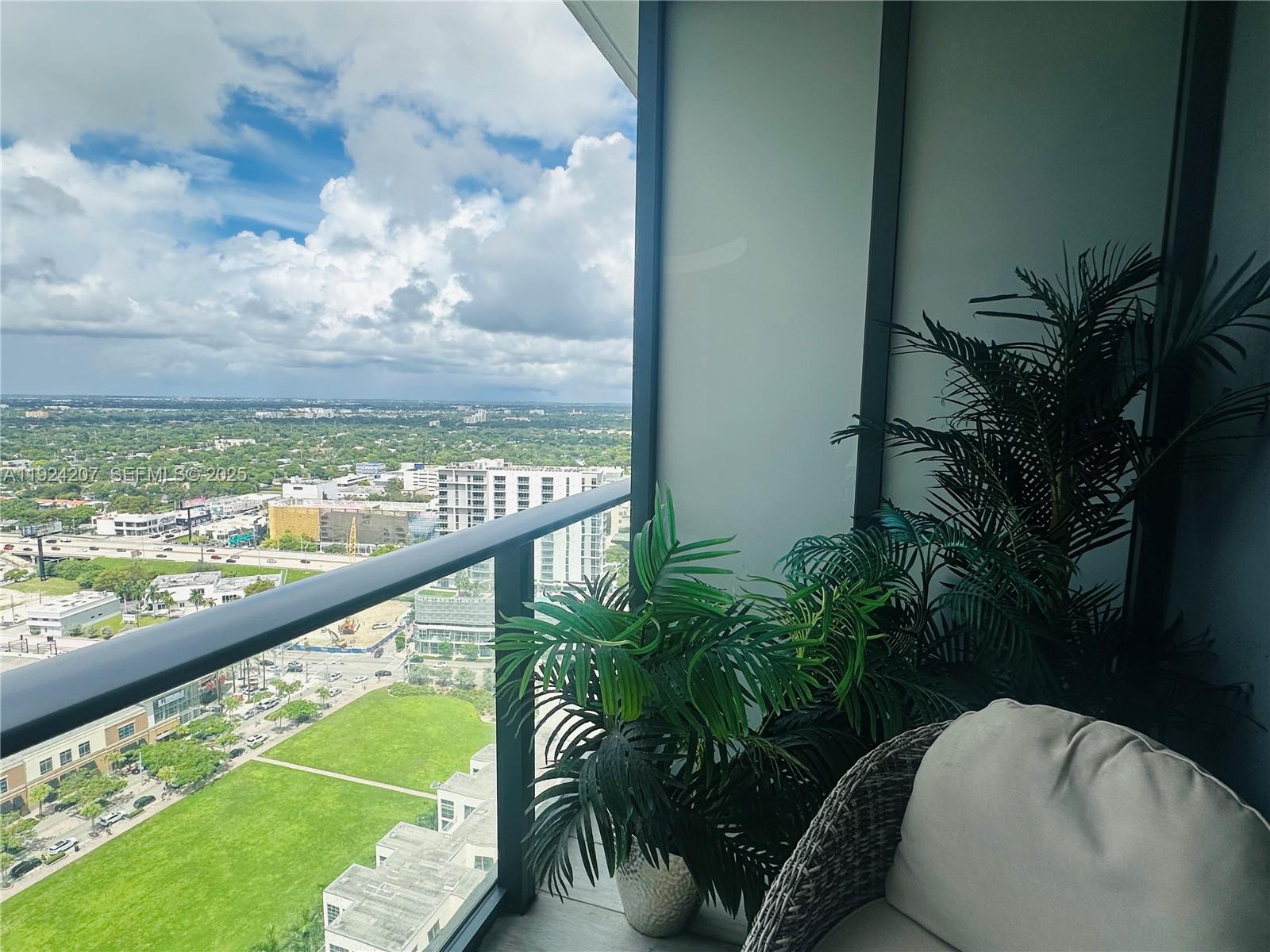 121 Northeast 34th Street, Unit 3014 Miami, FL 33137 - Photo 26 of 54 a view of a swimming pool with a balcony