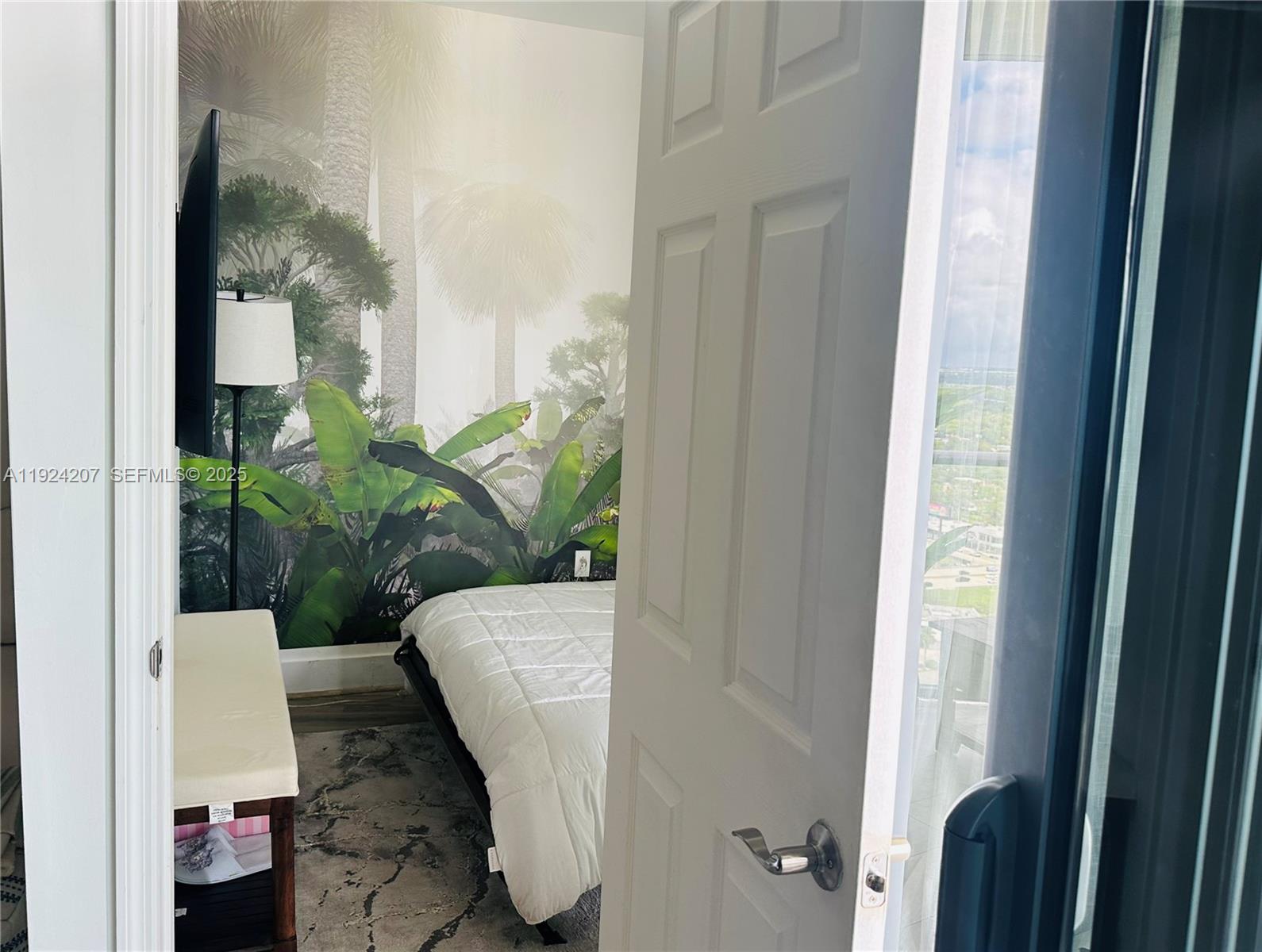 121 Northeast 34th Street, Unit 3014 Miami, FL 33137 - Photo 38 of 54 a potted plant sitting in front of a bathroom