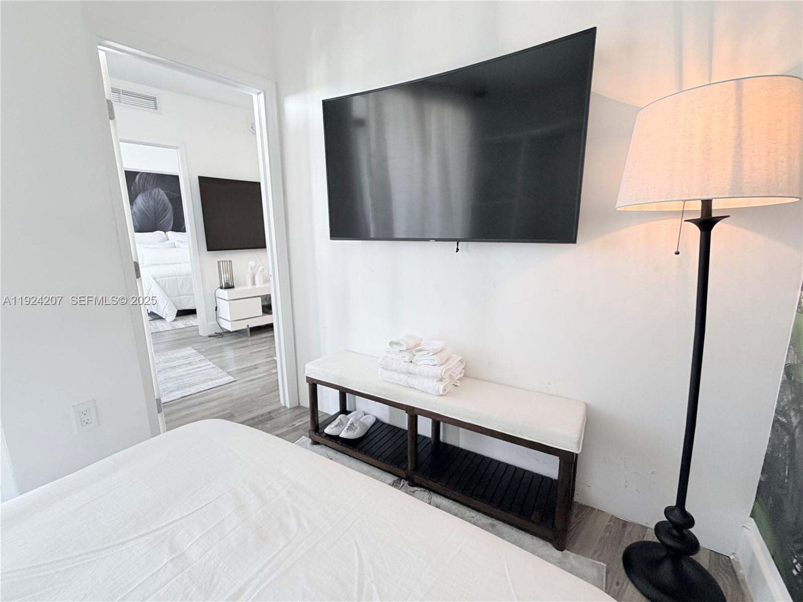 121 Northeast 34th Street, Unit 3014 Miami, FL 33137 - Photo 45 of 54 a bathroom with a sink and mirror