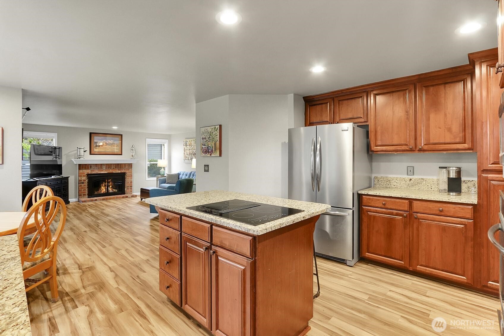 2107 237th Place Southeast Bothell, WA 98021 - Photo 14 of 40 a kitchen with stainless steel appliances granite countertop a sink stove refrigerator and a microwave