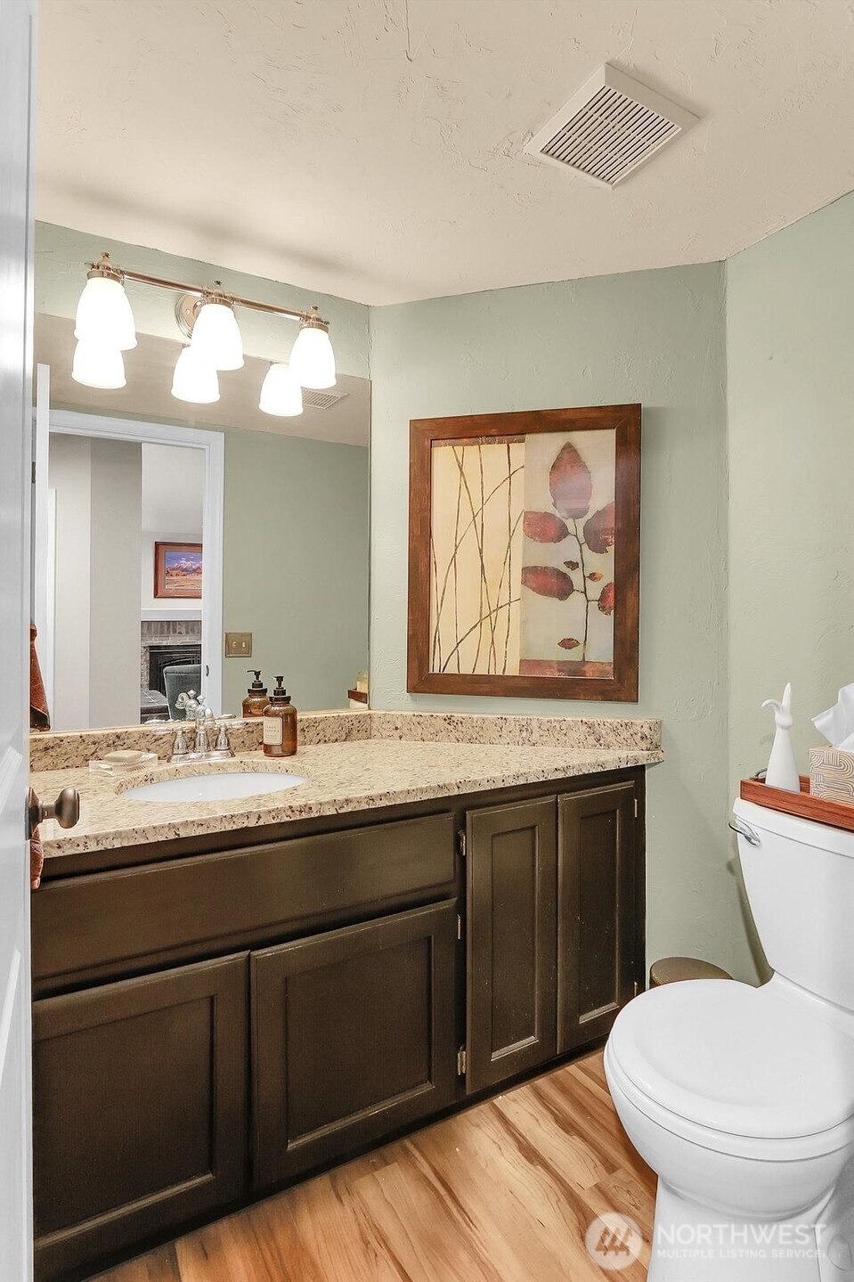 2107 237th Place Southeast Bothell, WA 98021 - Photo 21 of 40 a bathroom with a toilet sink and mirror