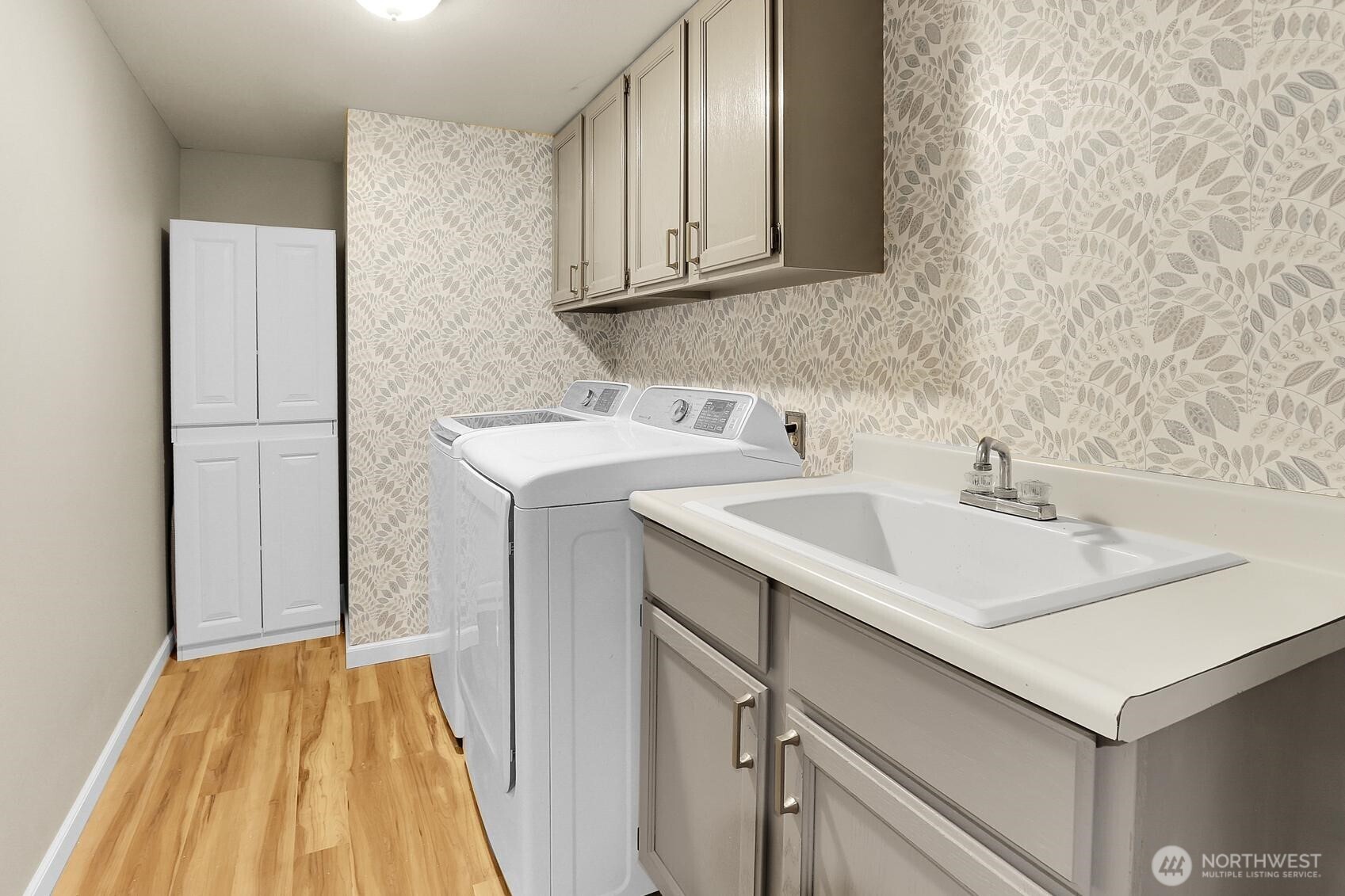 2107 237th Place Southeast Bothell, WA 98021 - Photo 22 of 40 a utility room with a sink washer and dryer