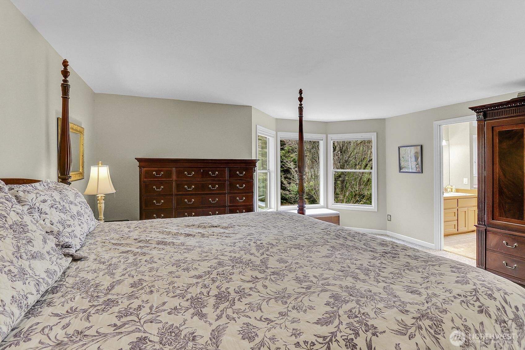 2107 237th Place Southeast Bothell, WA 98021 - Photo 28 of 40 a large bedroom with a bed and a fireplace