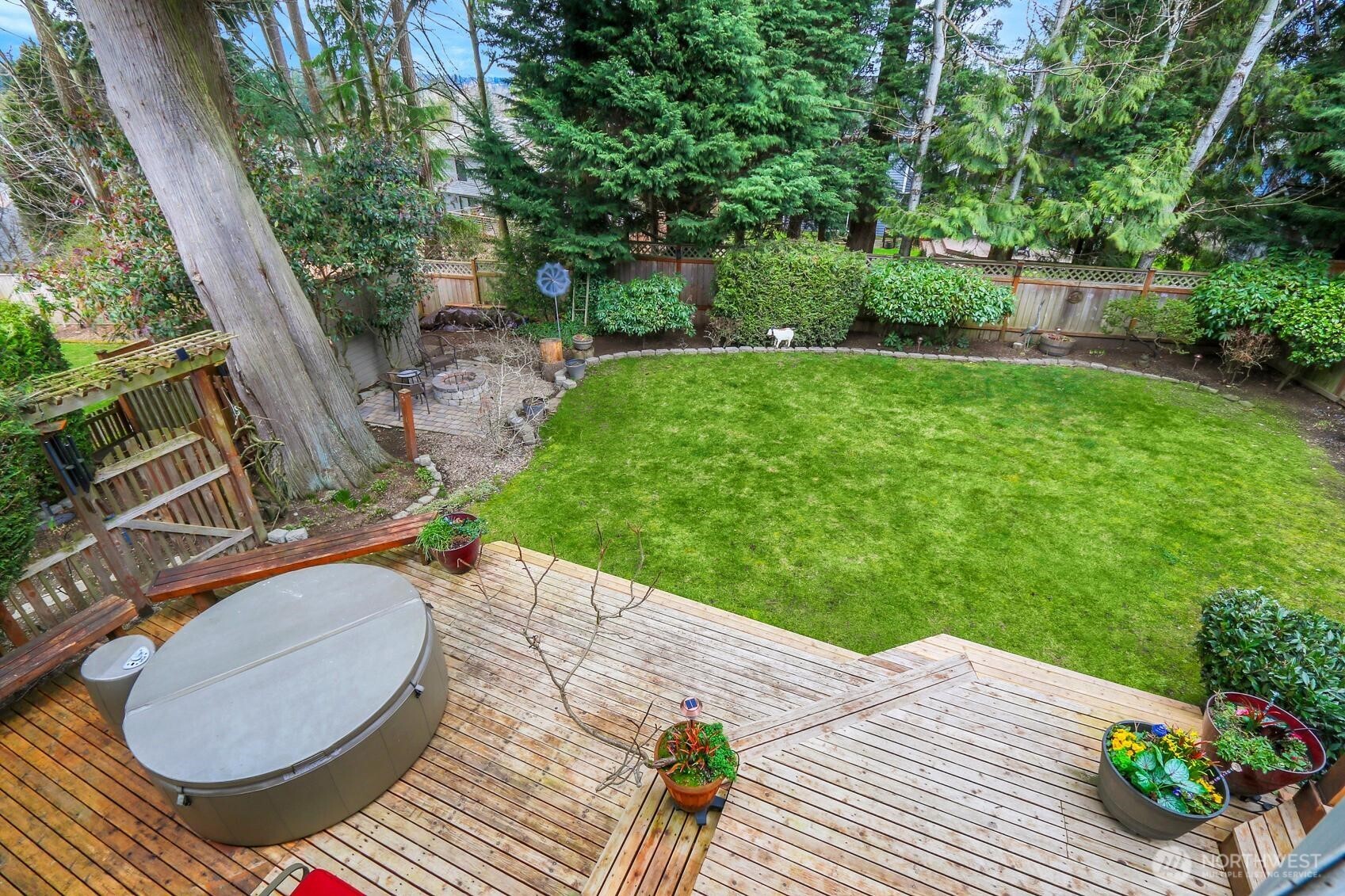 2107 237th Place Southeast Bothell, WA 98021 - Photo 36 of 40 a backyard of a house with table and chairs