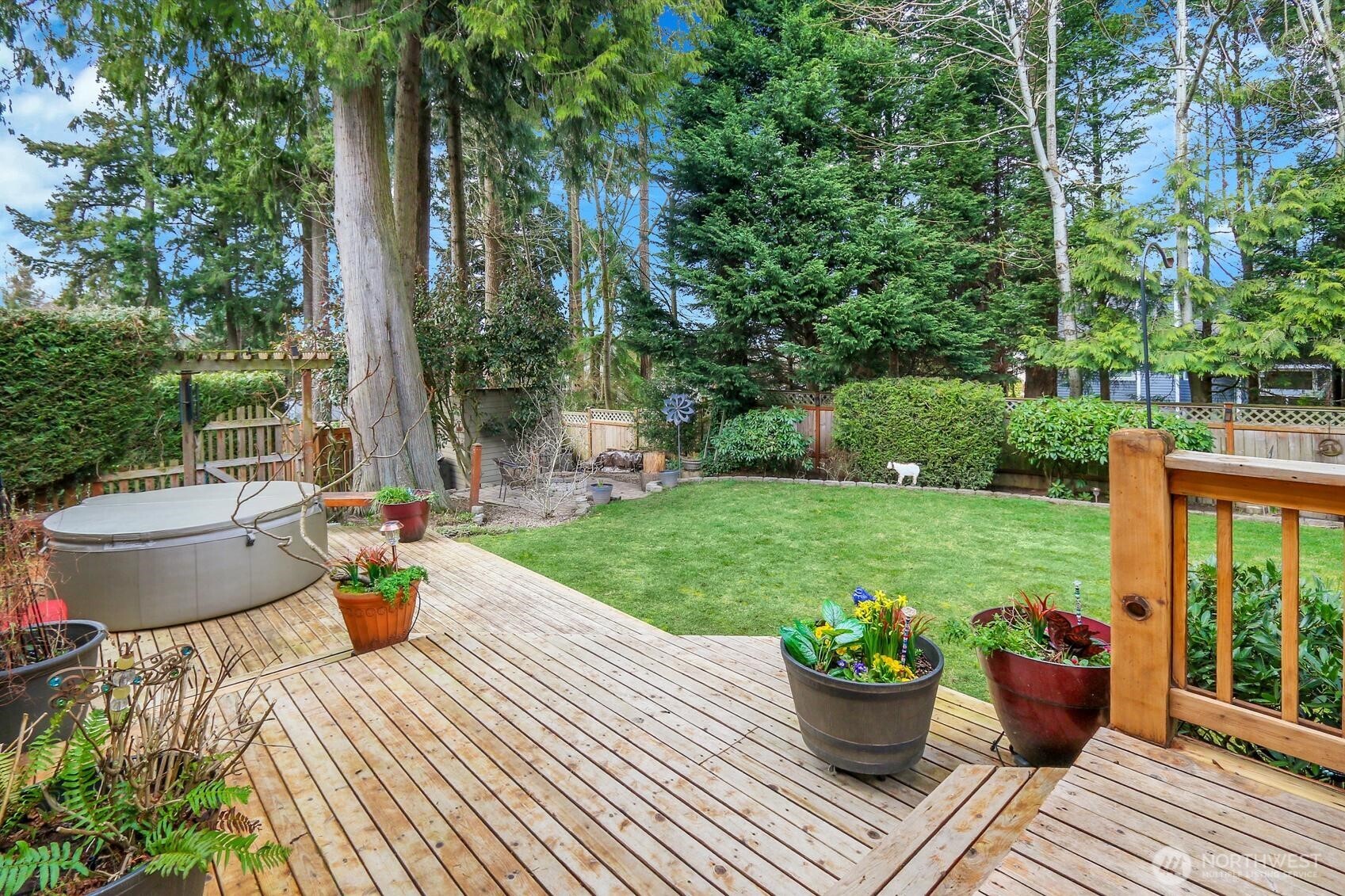 2107 237th Place Southeast Bothell, WA 98021 - Photo 37 of 40 a view of a backyard with sitting area and garden