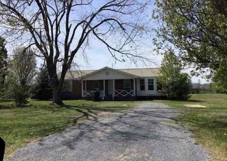 1507 Marshall Road Rainsville, AL 35986 - Photo 1 of 1 a front view of a house with a yard