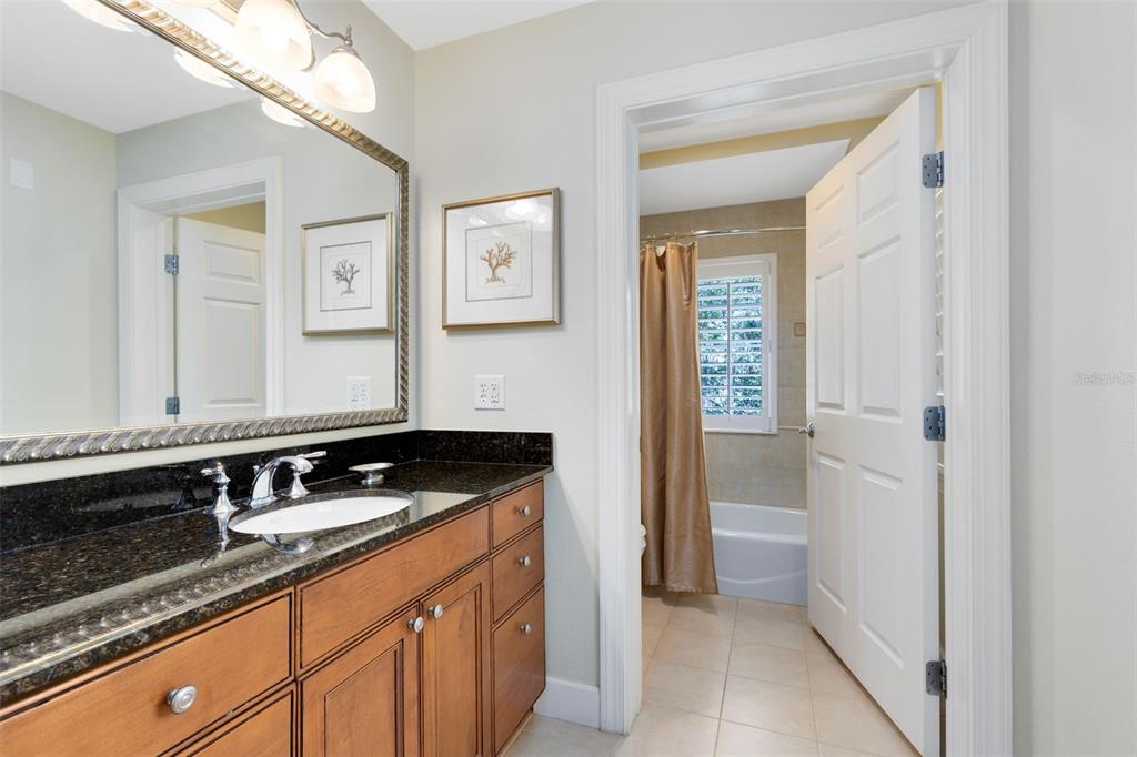 1360 Centre Ct Ridge Drive, Unit 201 Reunion, FL 34747 - Photo 19 of 29 a bathroom with a sink and a mirror