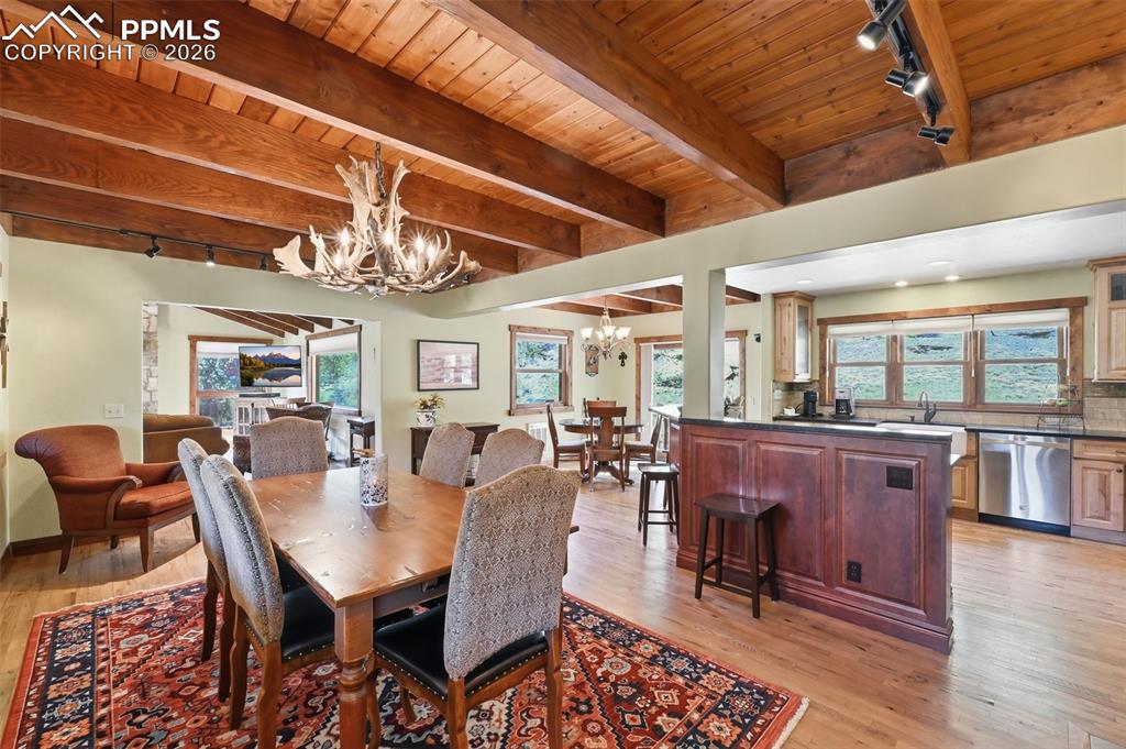 89 Ranch View Road Florissant, CO 80816 - Photo 17 of 50 Seating will never be an issue, as this open floorplan provides room for a large dining table, a breakfast nook and island bar seating.