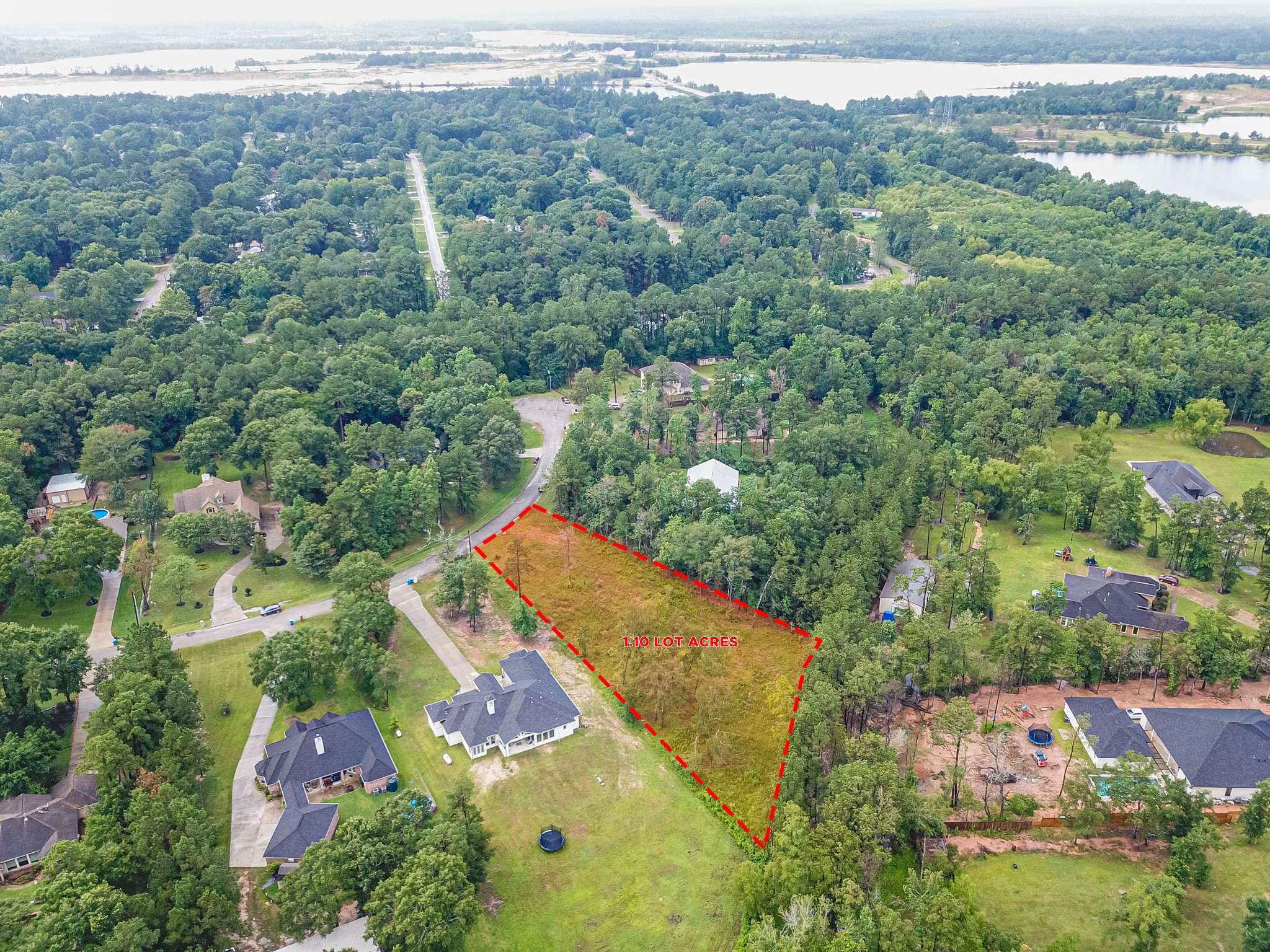 18332 Wisp Willow Way Porter, TX 77365 - Photo 12 of 48 an aerial view of a residential houses covered in trees