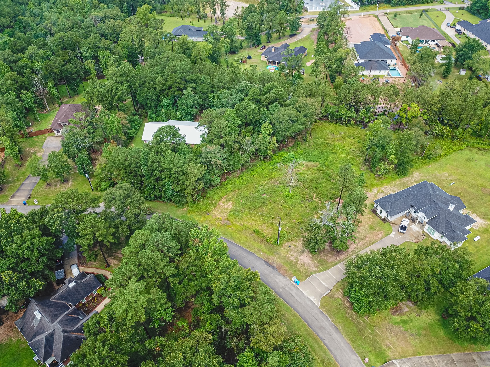18332 Wisp Willow Way Porter, TX 77365 - Photo 26 of 48 an aerial view of residential houses with outdoor space and trees