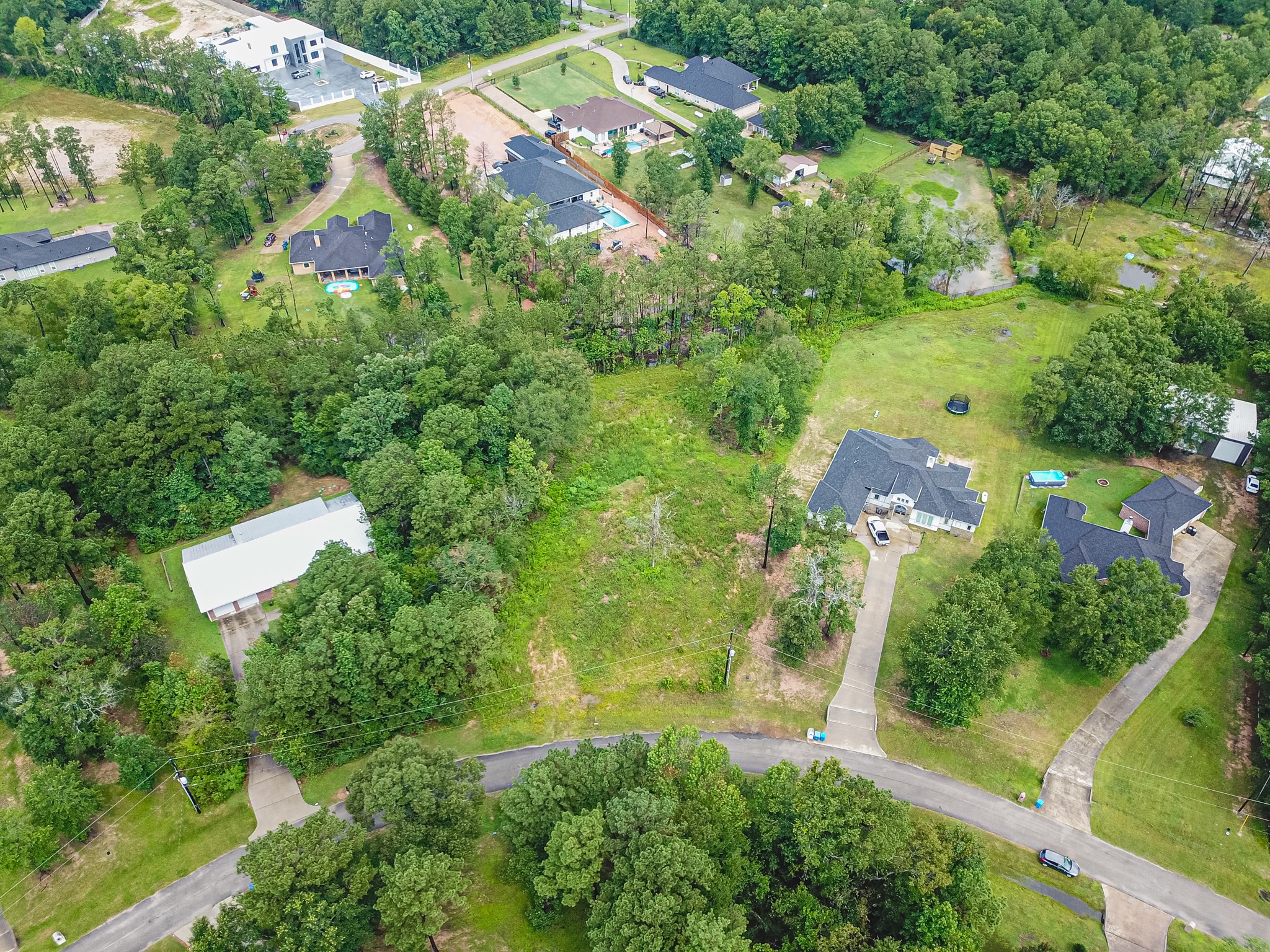 18332 Wisp Willow Way Porter, TX 77365 - Photo 27 of 48 an aerial view of residential houses with outdoor space and trees