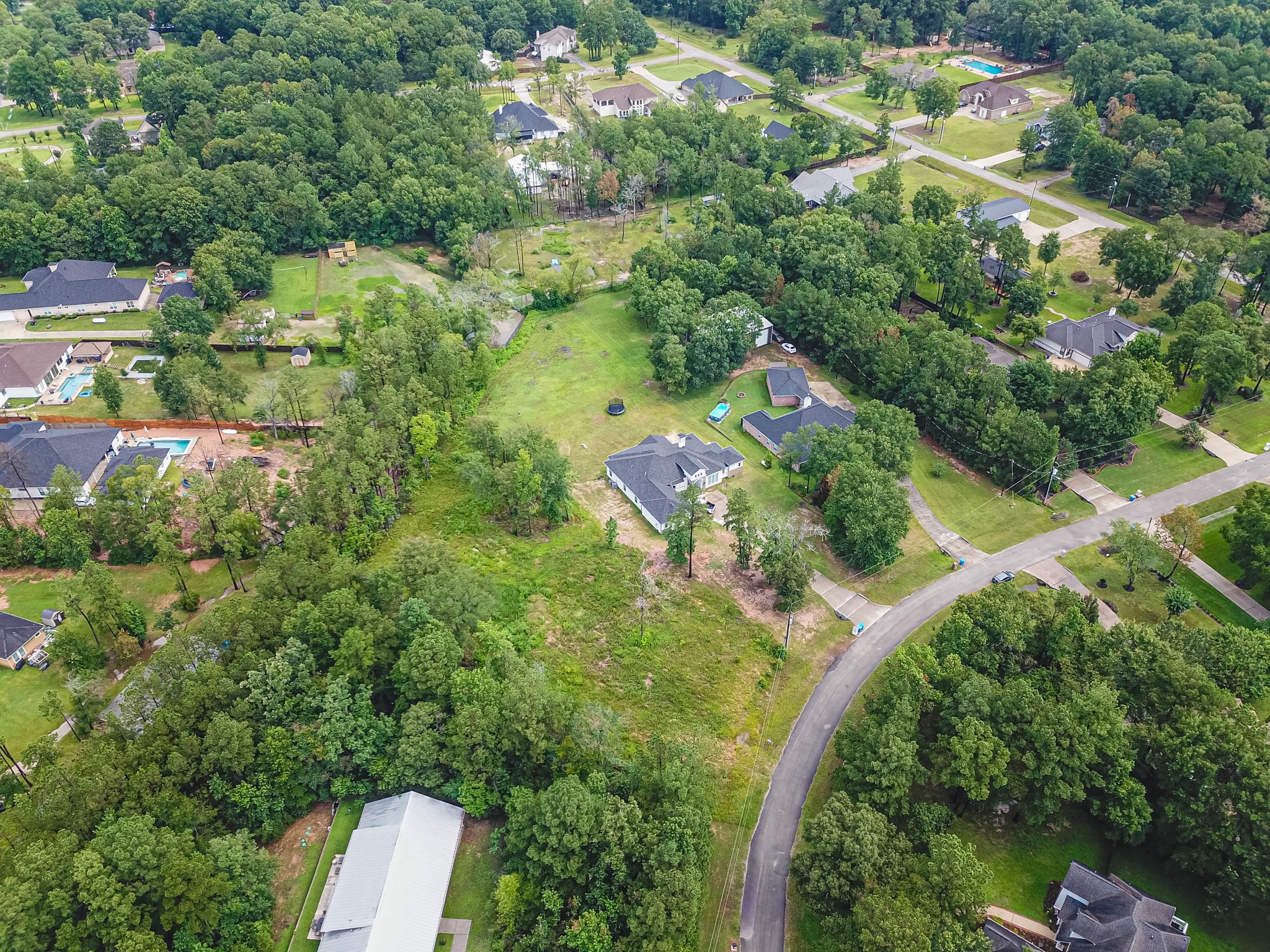 18332 Wisp Willow Way Porter, TX 77365 - Photo 29 of 48 an aerial view of residential houses with outdoor space and trees