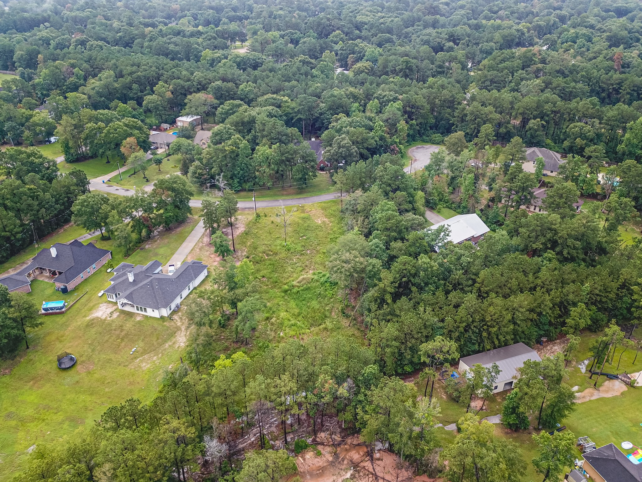 18332 Wisp Willow Way Porter, TX 77365 - Photo 34 of 48 an aerial view of residential houses with outdoor space and trees