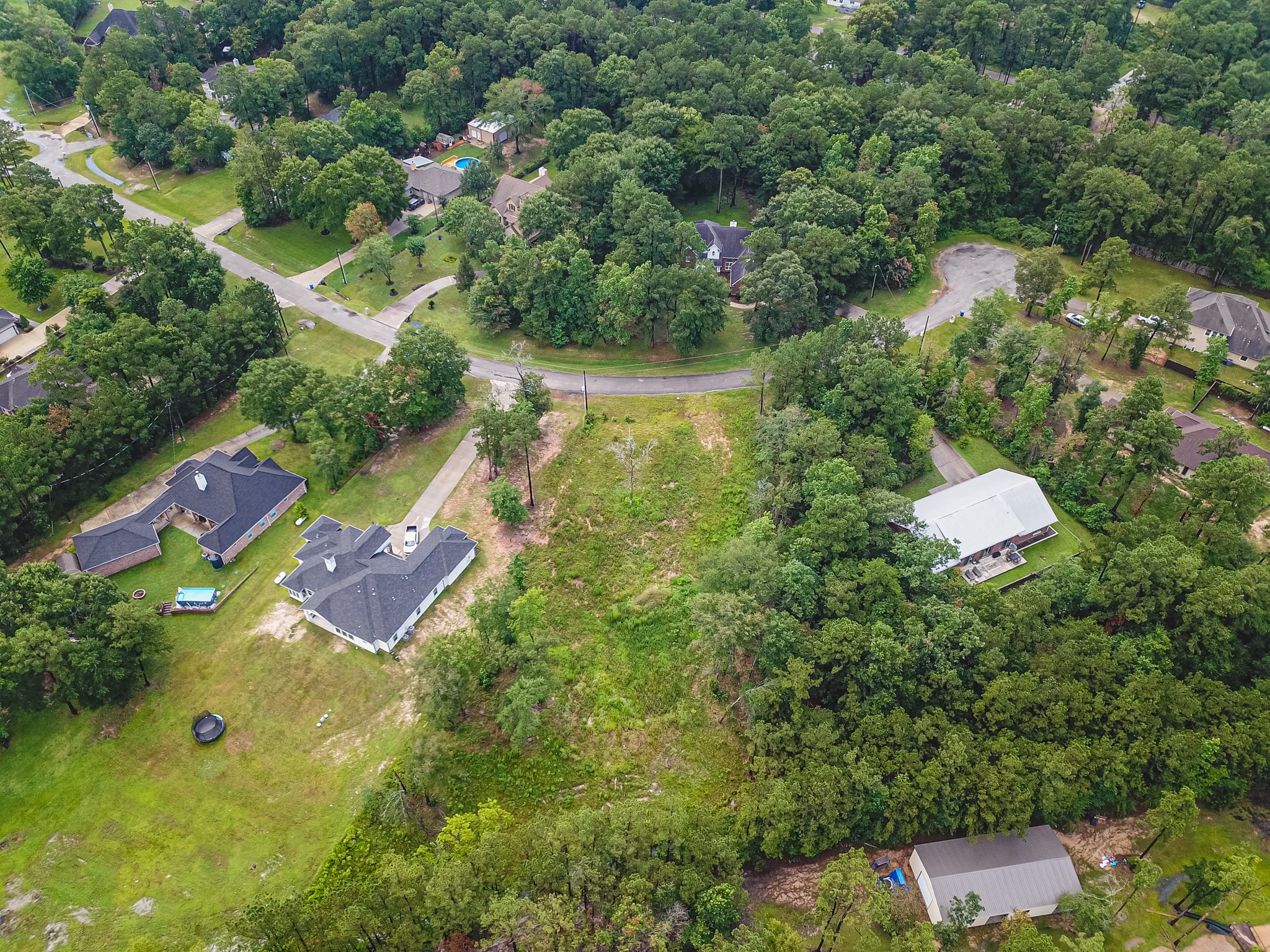 18332 Wisp Willow Way Porter, TX 77365 - Photo 39 of 48 an aerial view of residential house with outdoor space and trees all around