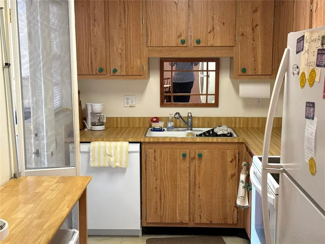 a kitchen with a stove and a cabinet