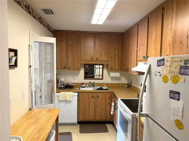 a kitchen with a stove a refrigerator and a stove
