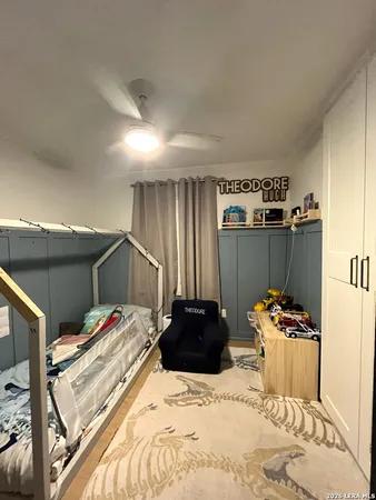 a bedroom with a bed and a closet