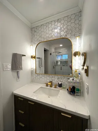 a bathroom with a sink and a mirror