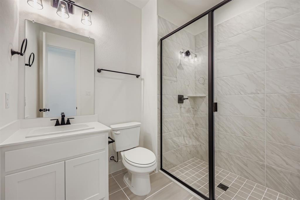 1841 Pk Vista Way Midlothian, TX 76065 - Photo 16 of 28 a bathroom with a sink a toilet and shower