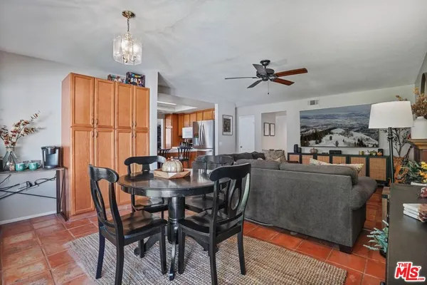 a view of a dining room with furniture window and outside view