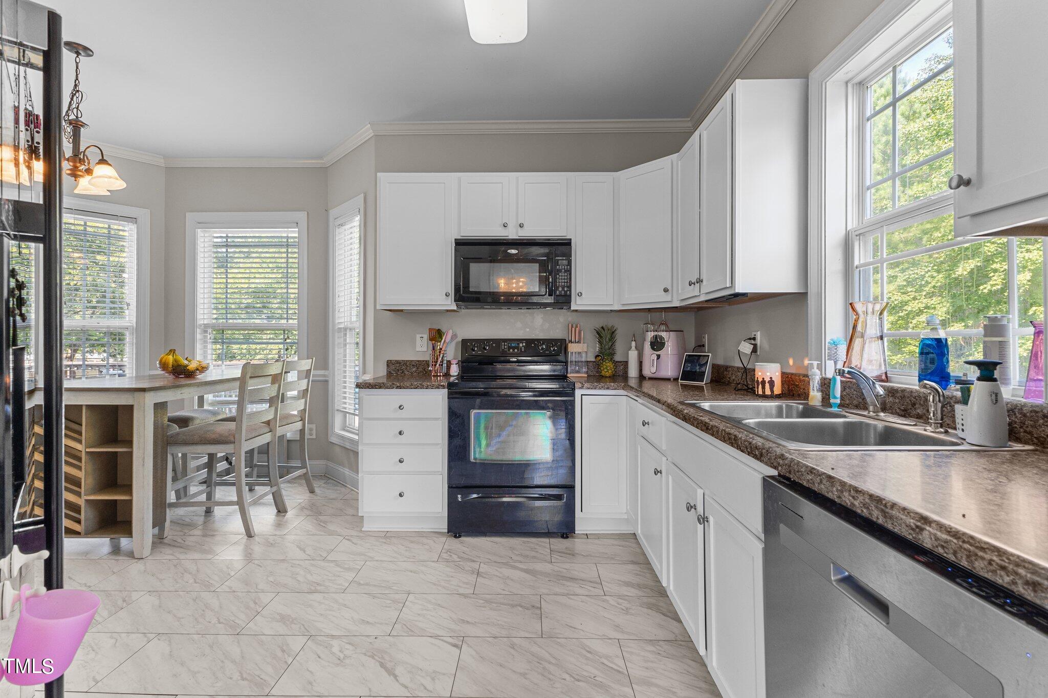 156 Williams Creek Drive Erwin, NC 28339 - Photo 18 of 37 a kitchen with granite countertop a stove top oven sink and cabinets