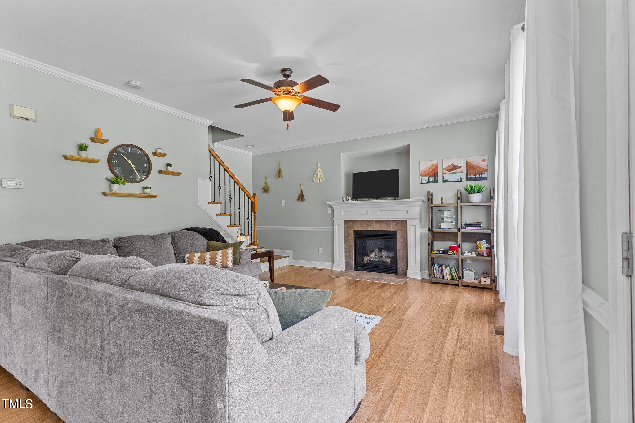 156 Williams Creek Drive Erwin, NC 28339 - Photo 21 of 37 a living room with furniture and a fireplace
