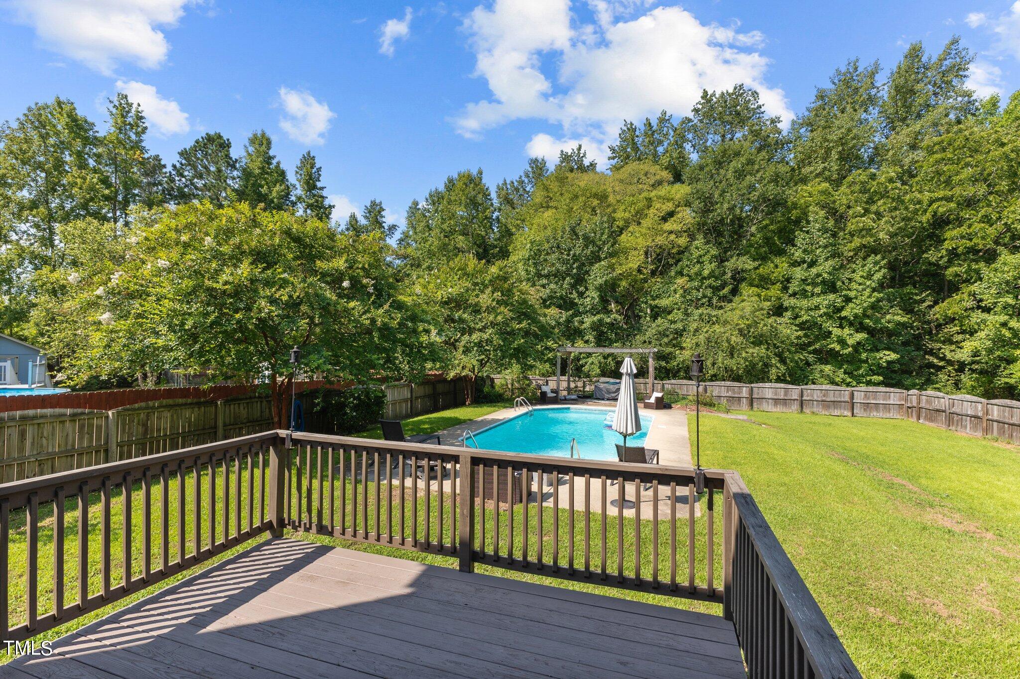 156 Williams Creek Drive Erwin, NC 28339 - Photo 25 of 37 a view of a wooden deck with a garden