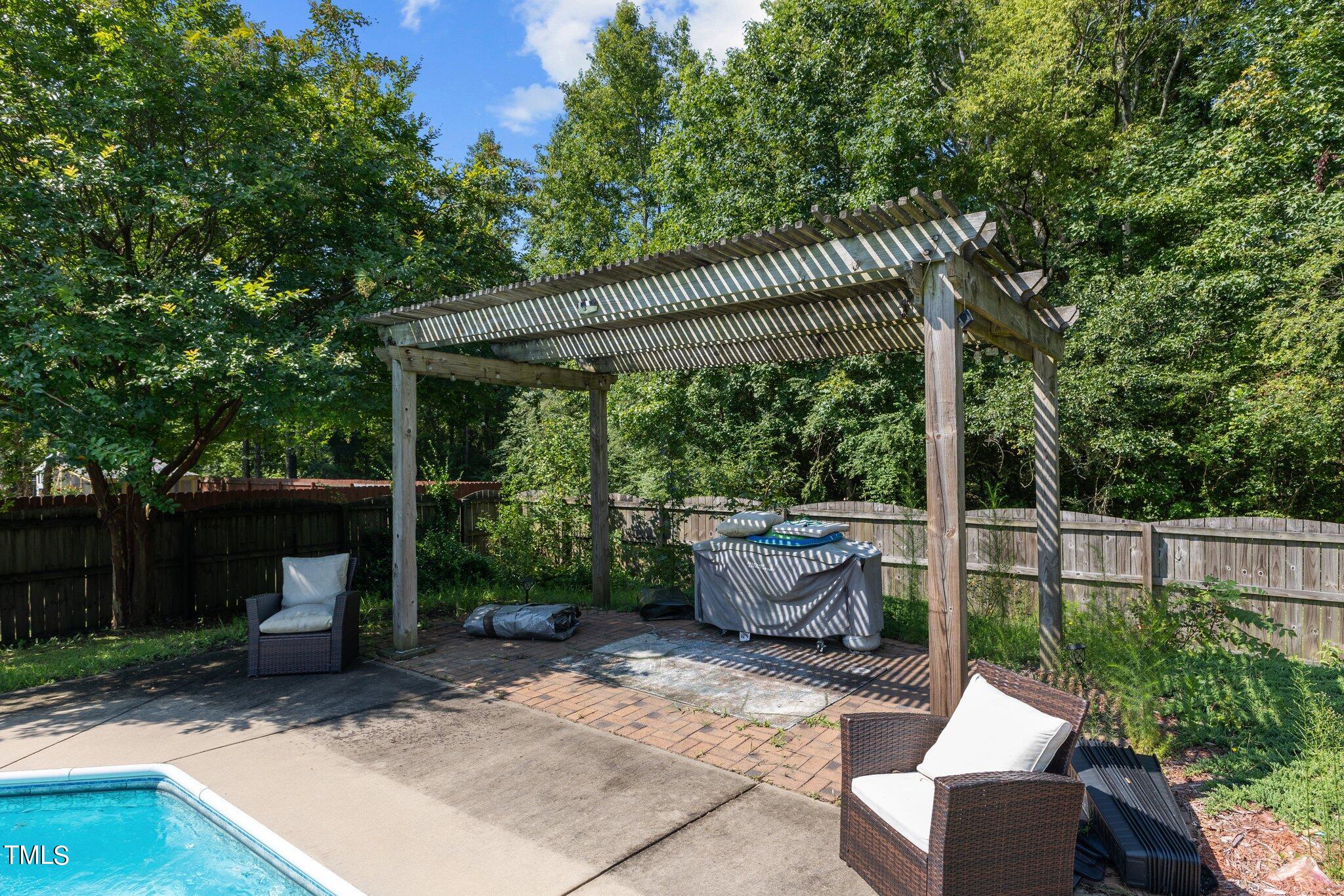 156 Williams Creek Drive Erwin, NC 28339 - Photo 27 of 37 a view of backyard with green space and outdoor seating