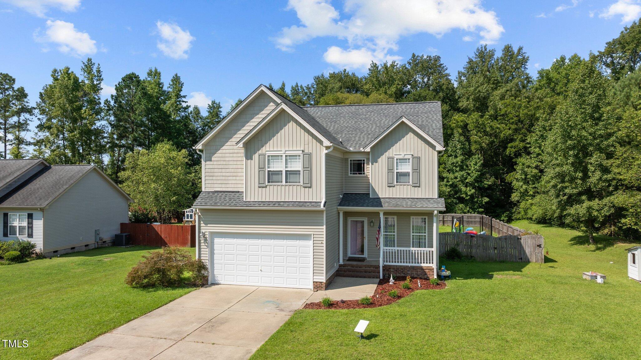 156 Williams Creek Drive Erwin, NC 28339 - Photo 31 of 37 a view of a house with a yard and large tree