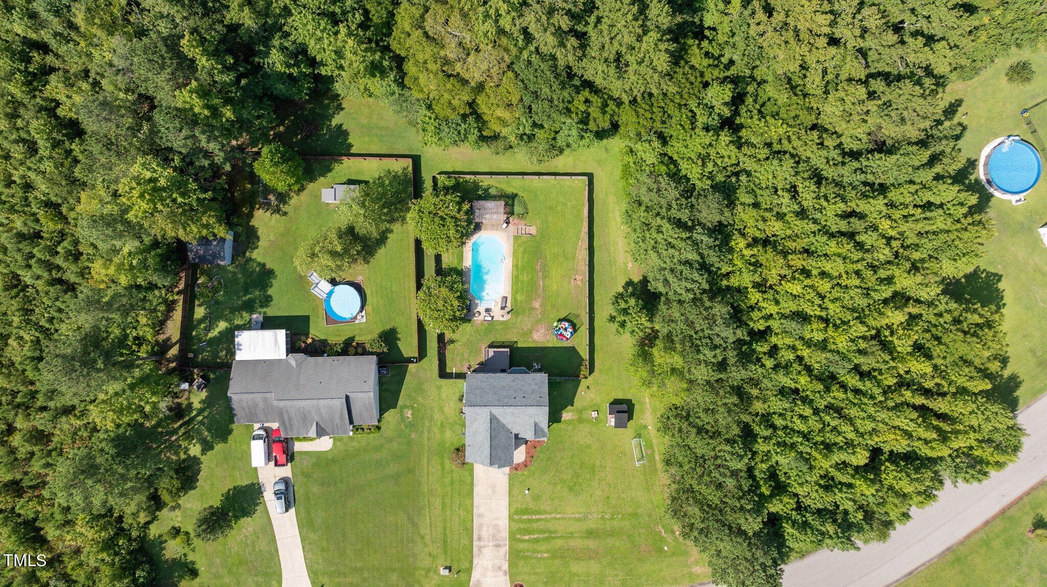 156 Williams Creek Drive Erwin, NC 28339 - Photo 33 of 37 an aerial view of a house with a yard table and chairs