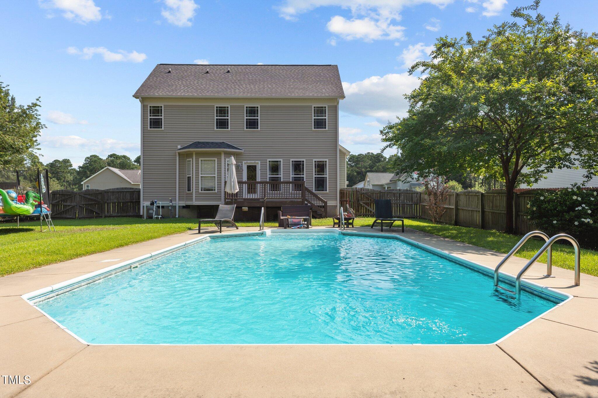 156 Williams Creek Drive Erwin, NC 28339 - Photo 4 of 37 a view of a house with a swimming pool