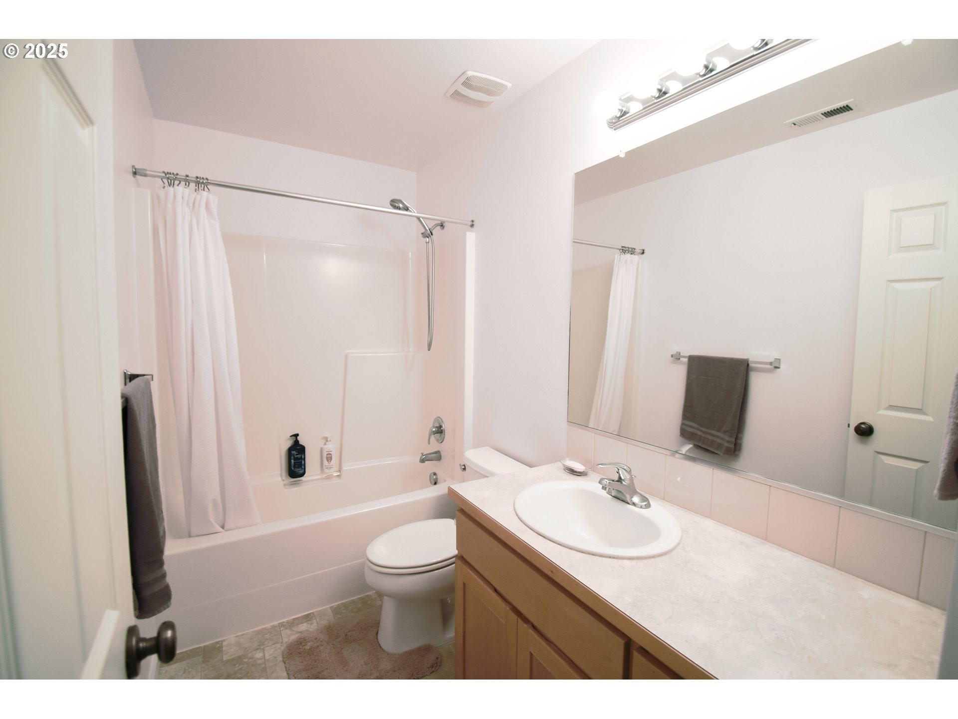 45 Katani Lane Cascade Locks, OR 97014 - Photo 17 of 28 a bathroom with a granite countertop sink toilet a shower and a mirror