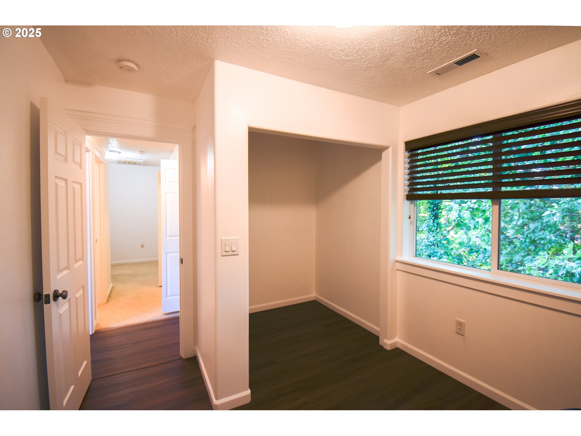 45 Katani Lane Cascade Locks, OR 97014 - Photo 22 of 28 a view of an empty room with wooden floor and a window