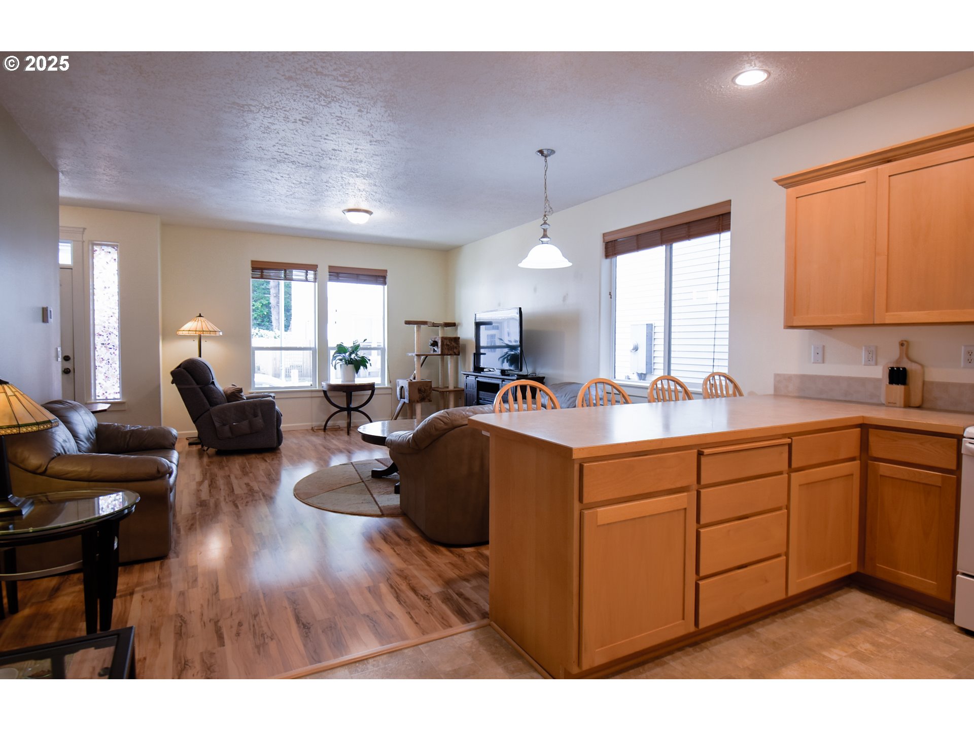 45 Katani Lane Cascade Locks, OR 97014 - Photo 6 of 28 a large living room with stainless steel appliances granite countertop furniture a fireplace and a large window