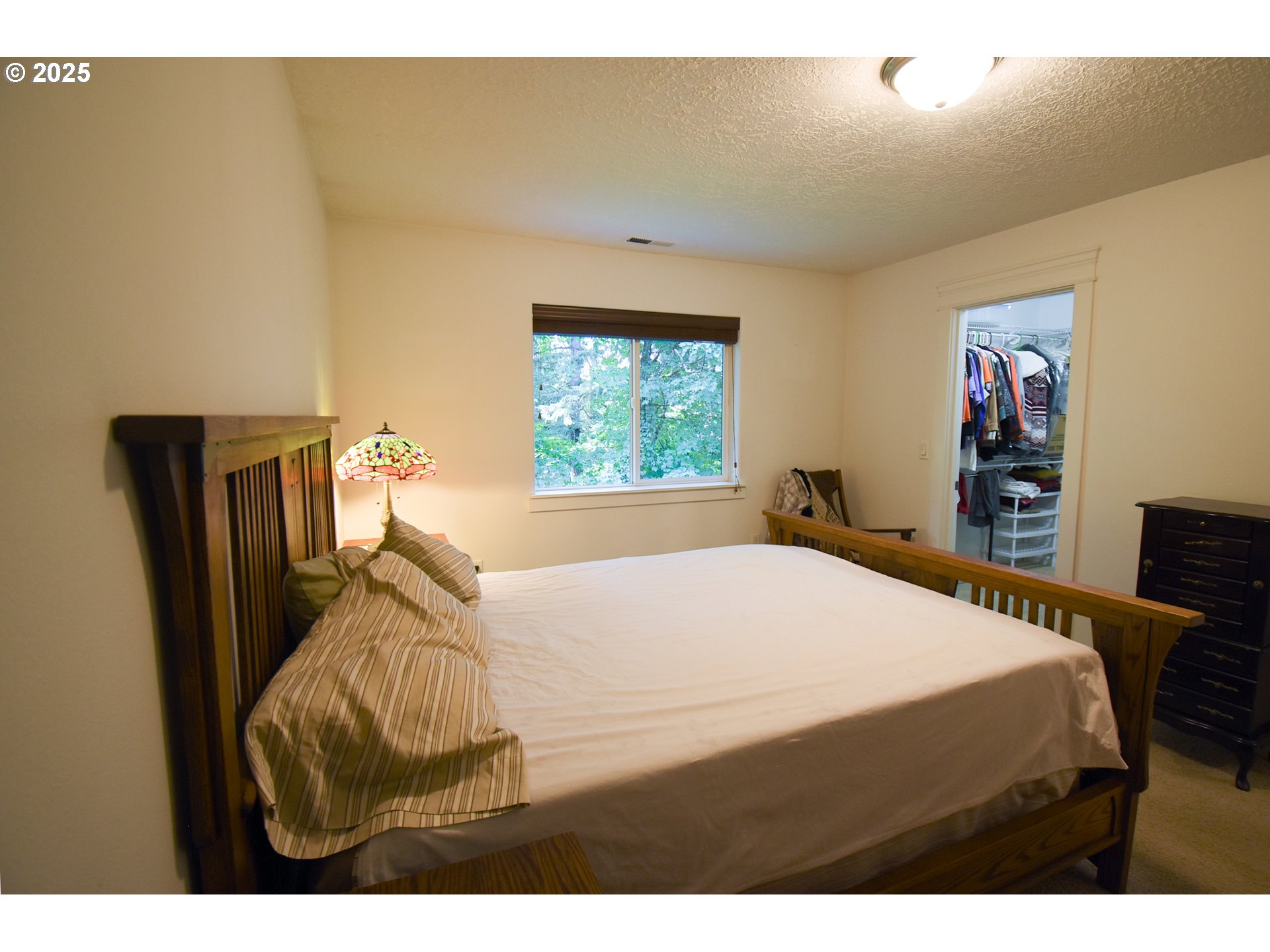45 Katani Lane Cascade Locks, OR 97014 - Photo 9 of 28 a bedroom with a bed and a window